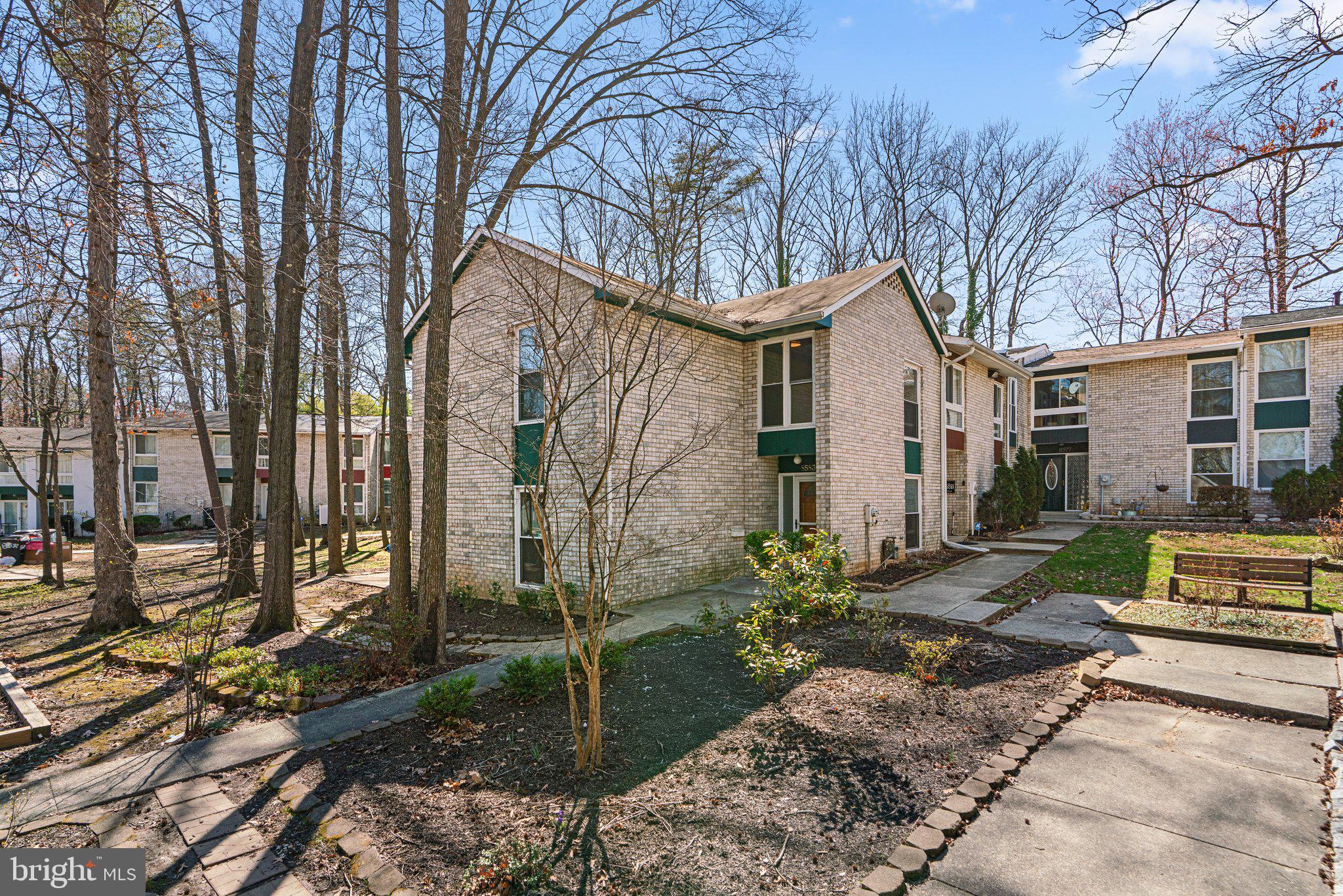8583 Seasons Way Lanham, MD 20706 - Photo 4 of 25 a front view of a house with garden