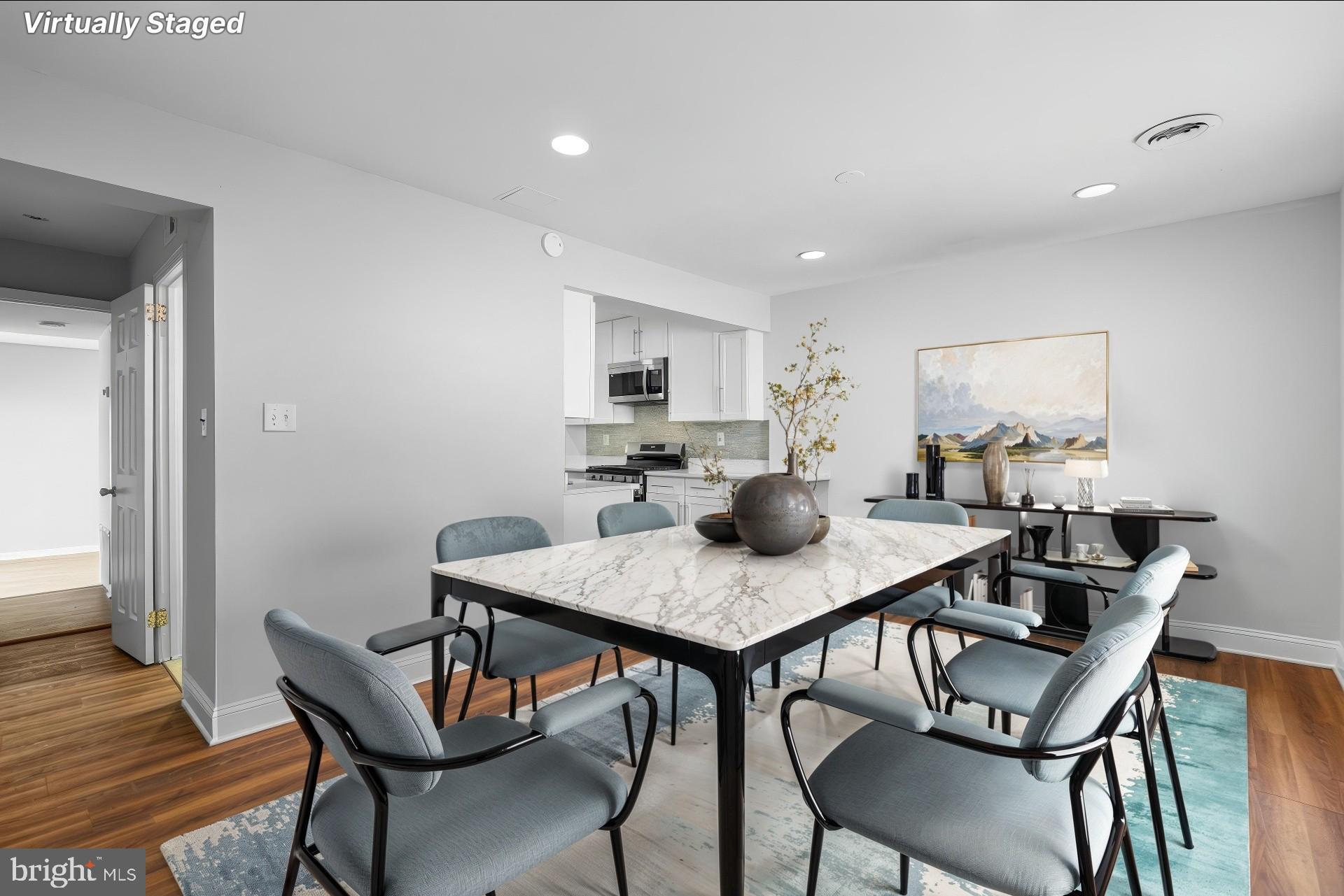 8583 Seasons Way Lanham, MD 20706 - Photo 5 of 25 a view of a dining room with furniture