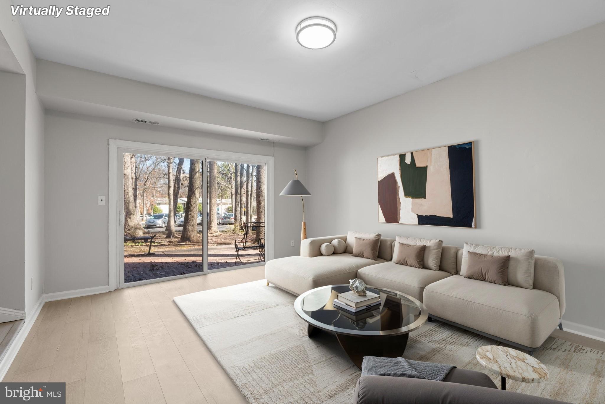 8583 Seasons Way Lanham, MD 20706 - Photo 10 of 25 a living room with furniture and a large window