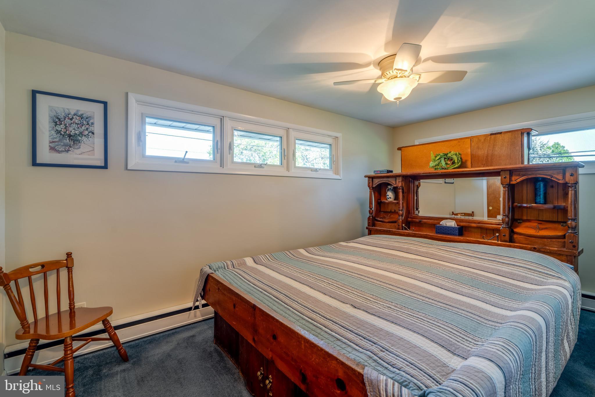 600 Kissel Hill Road Lititz, PA 17543 - Photo 20 of 30 a bedroom with a bed and a chandelier