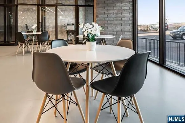 a dining room with furniture and window