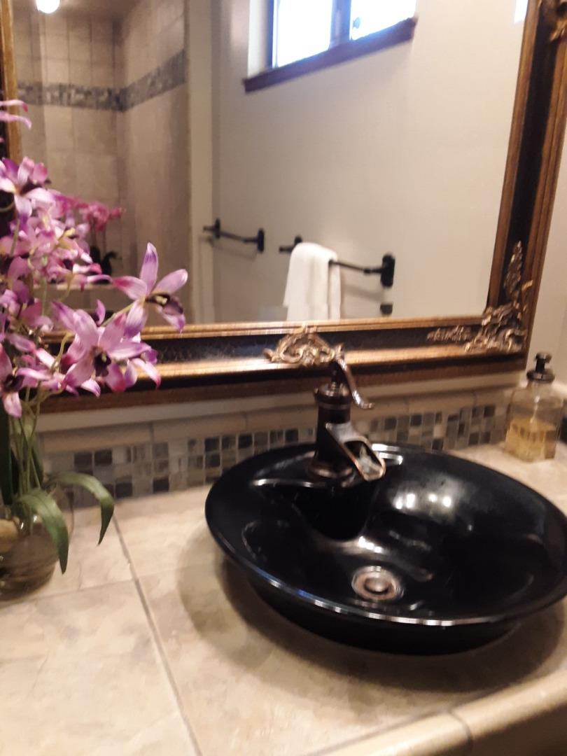 878 Rider Ridge Road Santa Cruz, CA 95065 - Photo 13 of 15 a bathroom with a sink and mirror