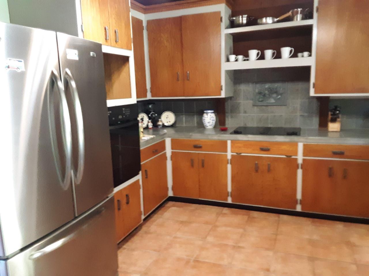 878 Rider Ridge Road Santa Cruz, CA 95065 - Photo 8 of 15 a kitchen with granite countertop a refrigerator and a cabinets