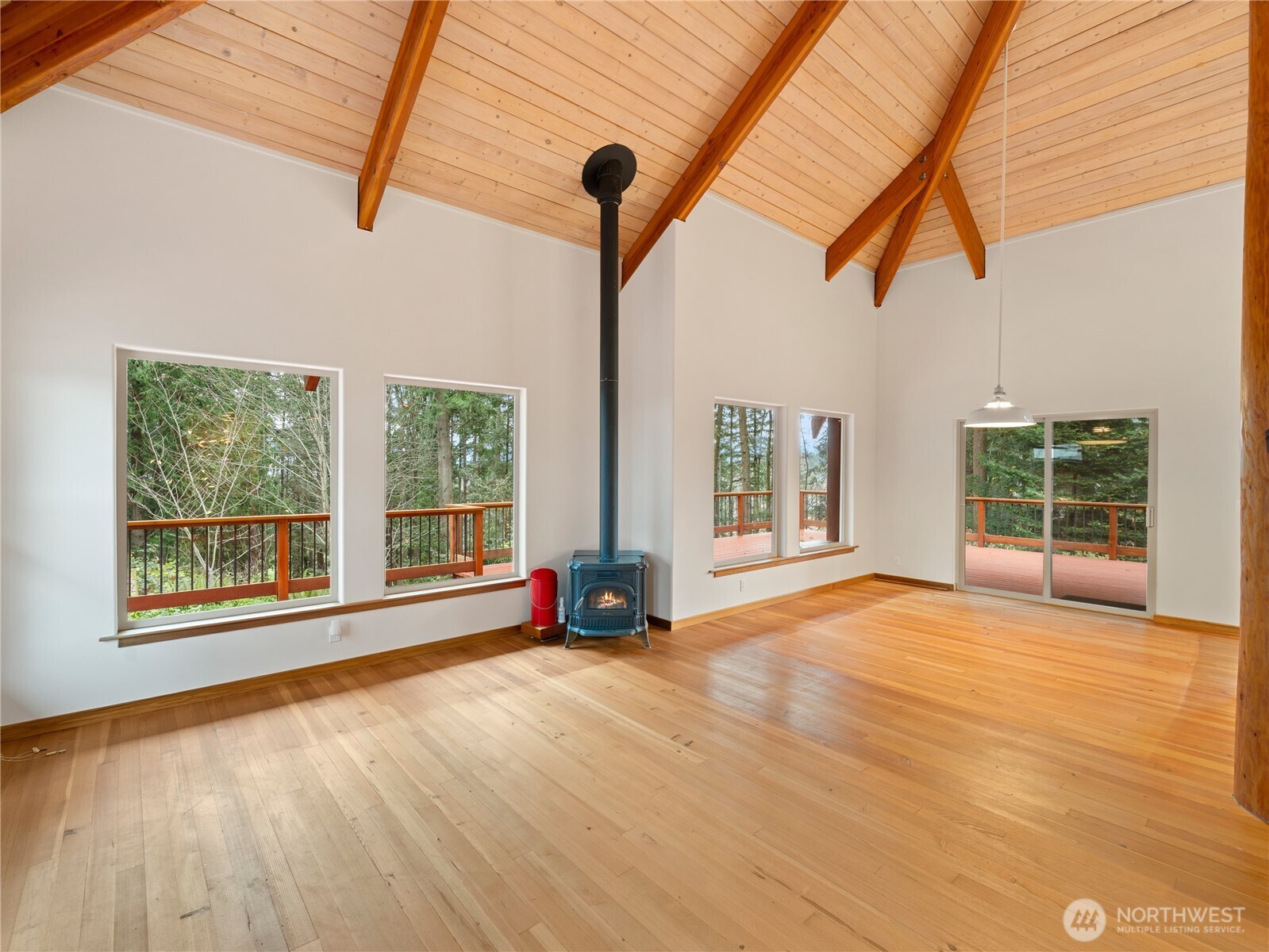 2204 41st Street Anacortes, WA 98221 - Photo 11 of 37 a view of an empty room with a window and wooden floor