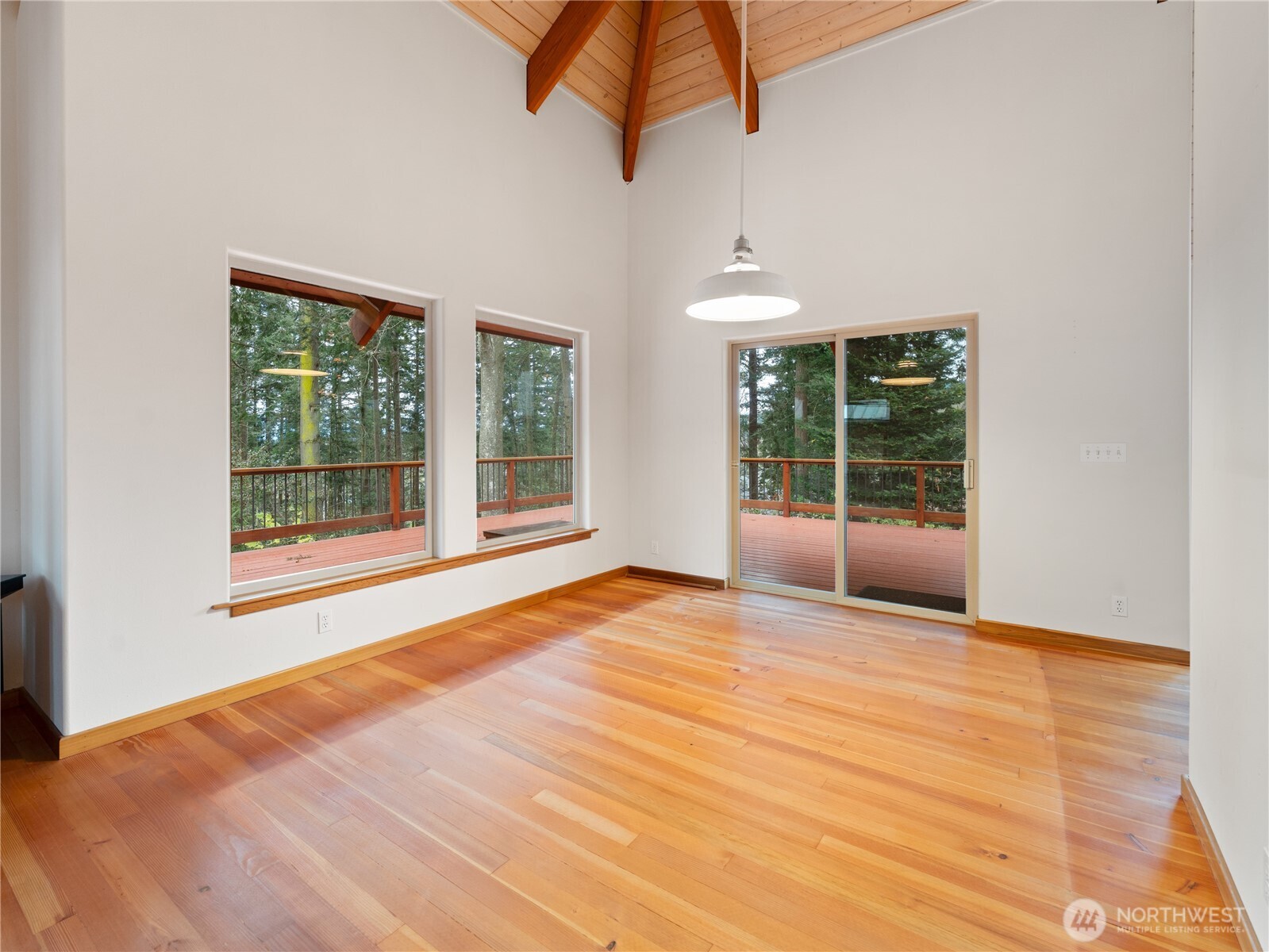 2204 41st Street Anacortes, WA 98221 - Photo 12 of 37 a view of an empty room with wooden floor and windows