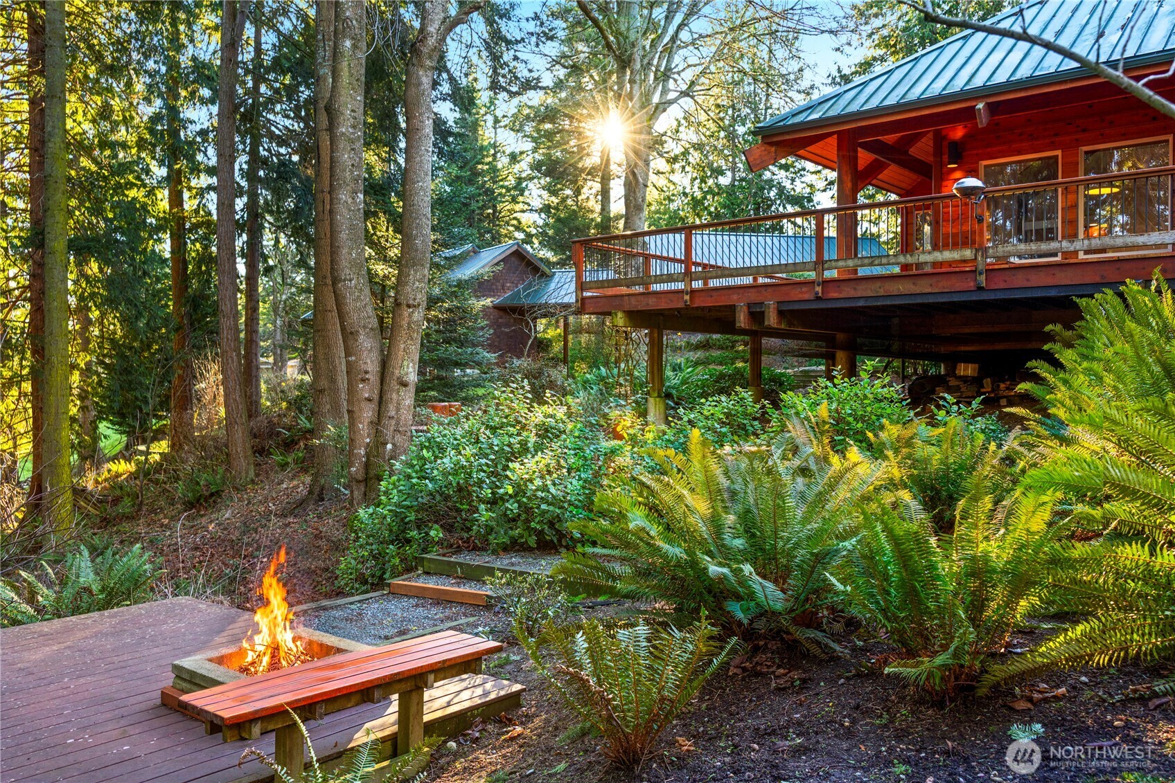 2204 41st Street Anacortes, WA 98221 - Photo 3 of 37 a backyard of a house with a table and chairs