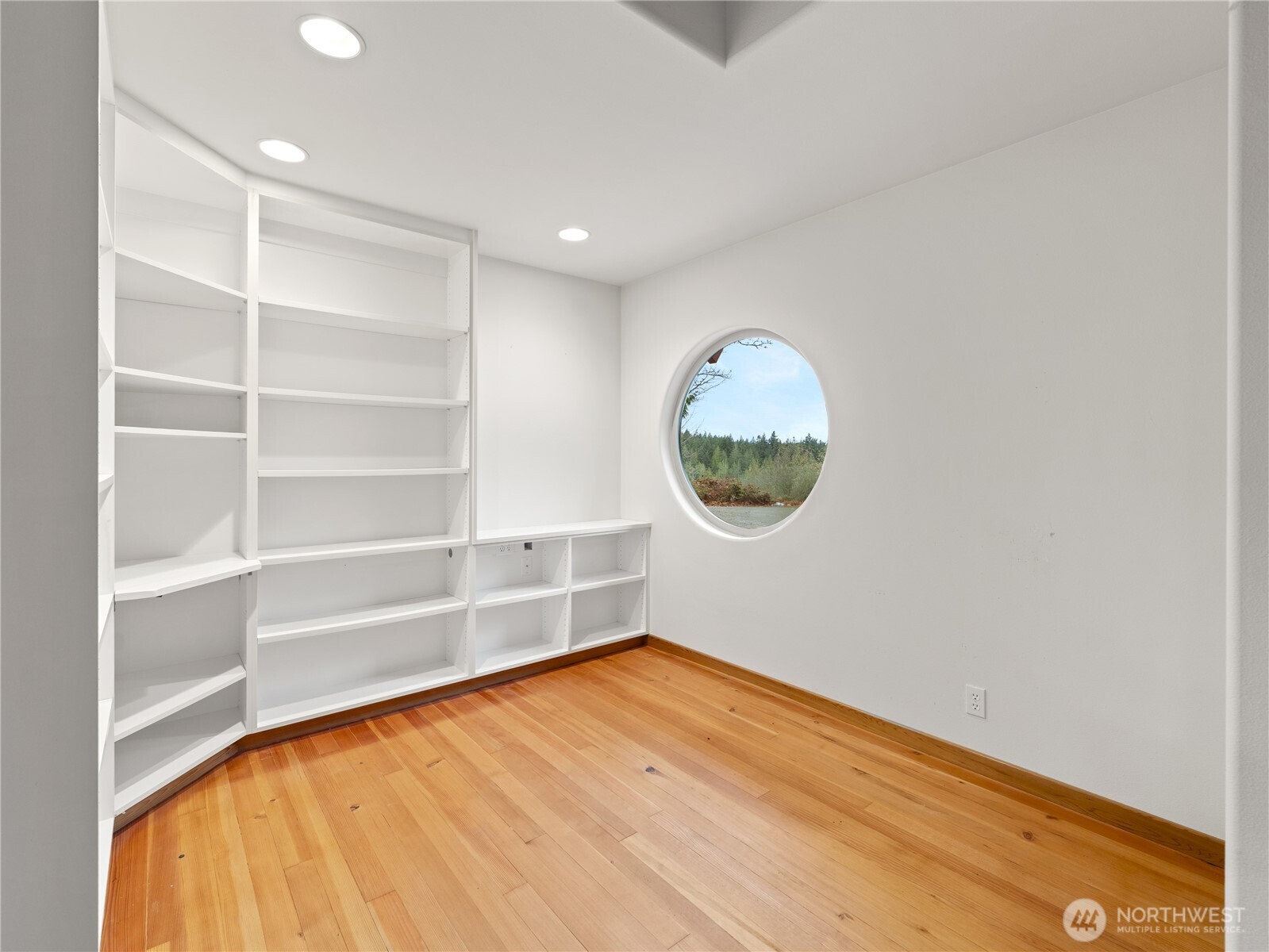 2204 41st Street Anacortes, WA 98221 - Photo 8 of 37 a view of a room with wooden floor and a window
