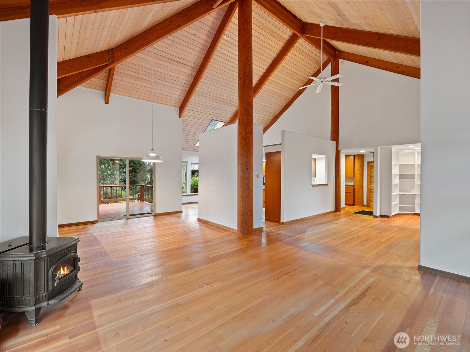 2204 41st Street Anacortes, WA 98221 - Photo 10 of 37 a view of an empty room with wooden floor and a window
