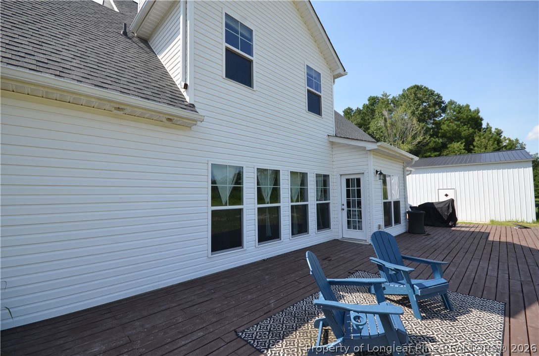 1865 John B Carter Road Fayetteville, NC 28312 - Photo 34 of 49 a view of a house with backyard and sitting area