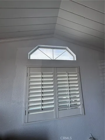 a view of living room with furniture and wooden floor