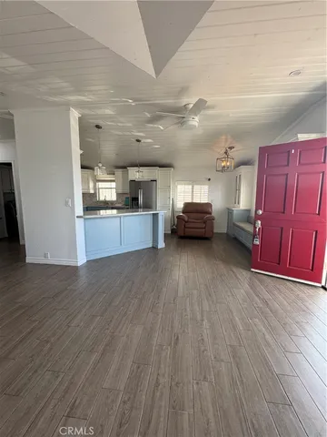 a view of kitchen with sink microwave and cabinets