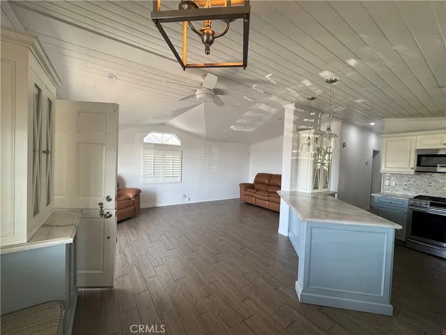 a view of outdoor space with wooden floor and windows