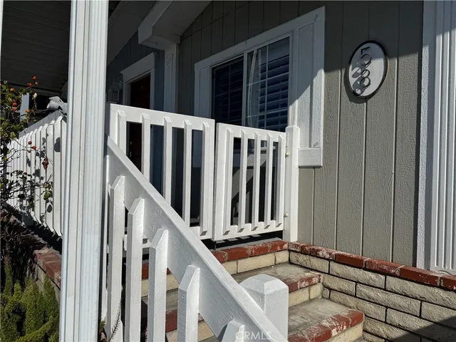 a view of a door with wooden floor and a window