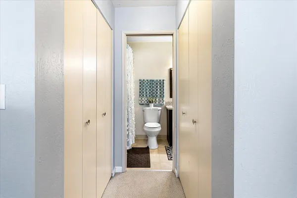 a view of a bathroom from a hallway