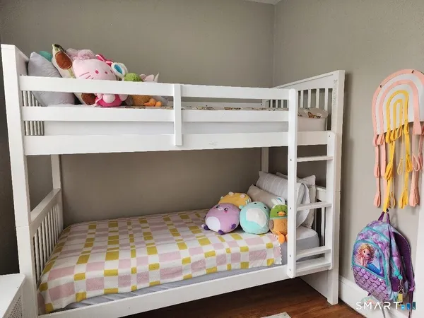a room with toys and dresser