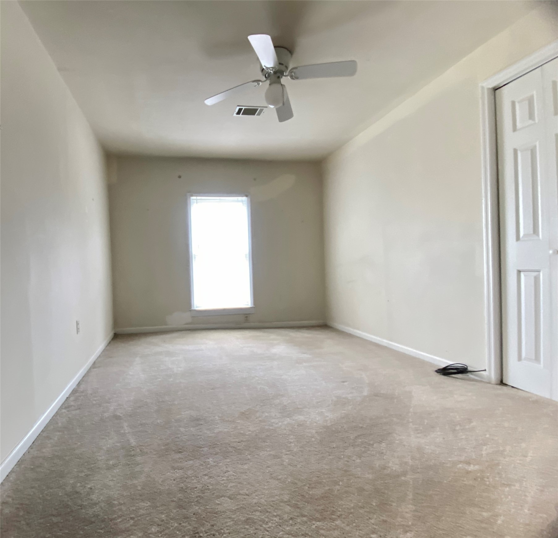 223 East Robert Toombs Avenue Washington, GA 30673 - Photo 37 of 46 an empty room with windows and fan