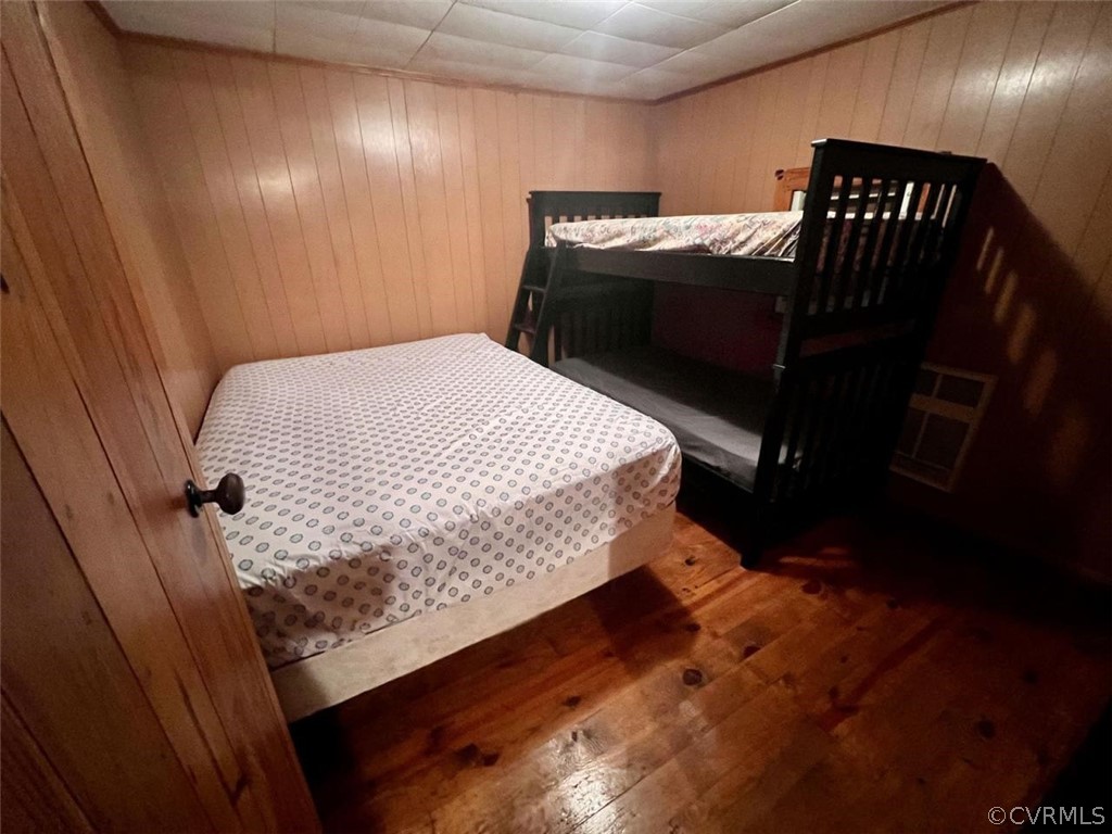 1300 Braley Pond Road West Augusta, VA 24485 - Photo 17 of 23 a bedroom with a bed and a mirror