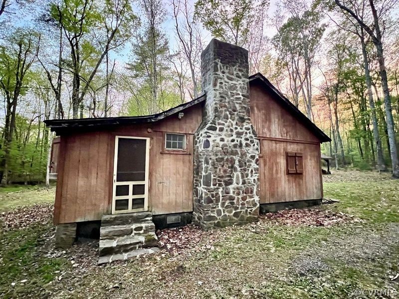 1300 Braley Pond Road West Augusta, VA 24485 - Photo 22 of 23 a view of a house with backyard and garden