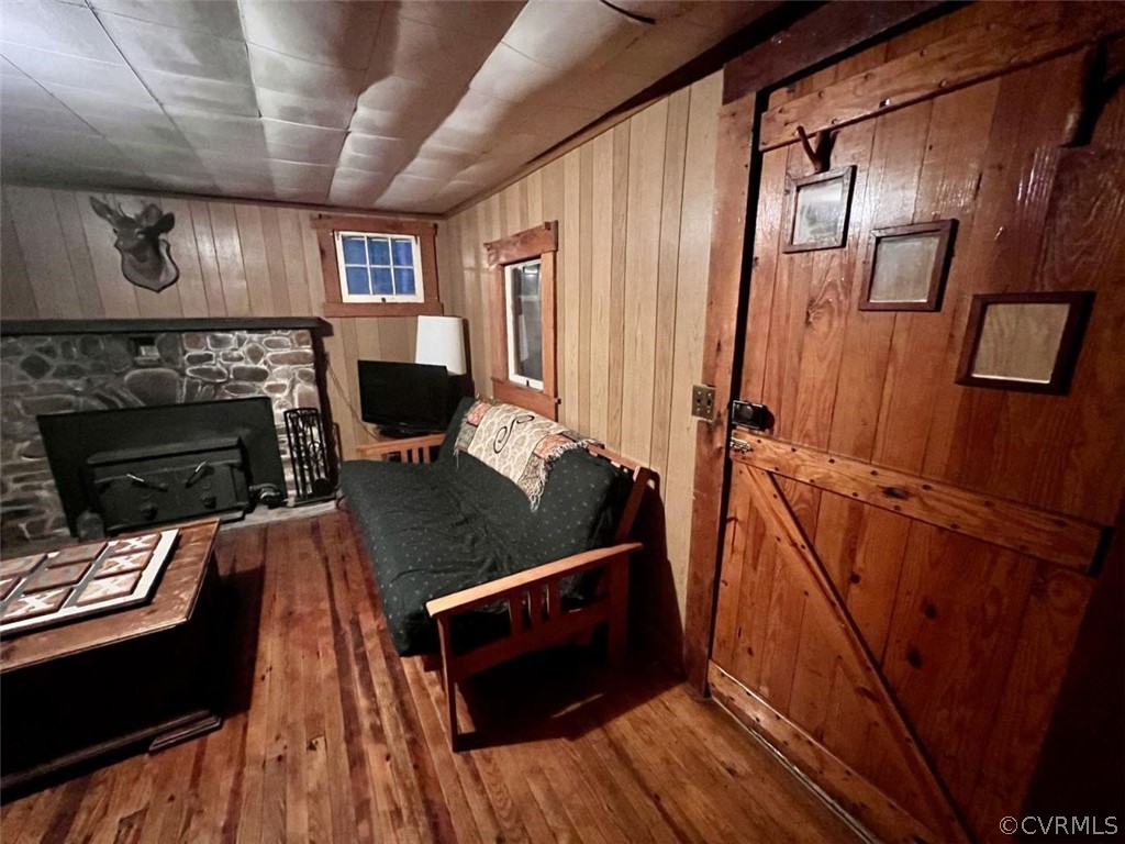 1300 Braley Pond Road West Augusta, VA 24485 - Photo 10 of 23 a living room with stainless steel appliances wooden floor a fireplace and a window