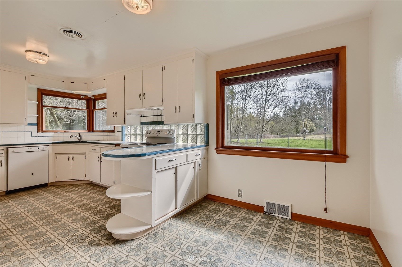 29017 Old Owen Road Monroe, WA 98272 - Photo 8 of 35 a kitchen with stainless steel appliances granite countertop a stove a sink and a microwave