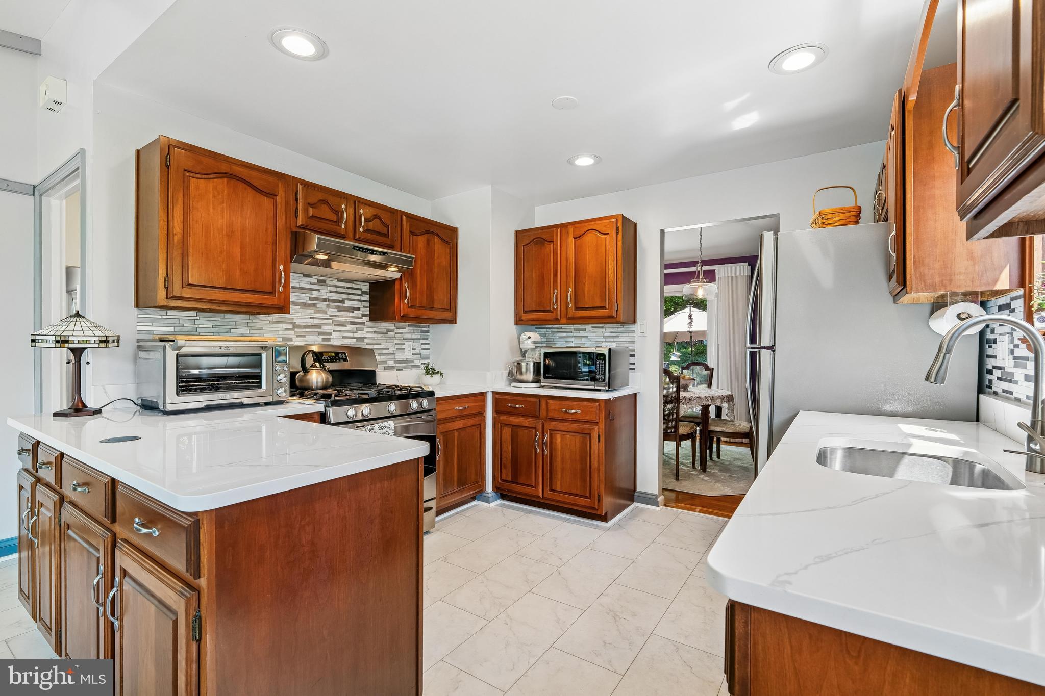 11728 Lovejoy Street Silver Spring, MD 20902 - Photo 14 of 43 Kitchen boasts cortex flooring, recessed lighting.