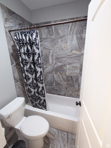552 Sunset Crest Way Draper, UT 84020 - Photo 56 of 68 Bathroom featuring shower / tub combo with curtain and toilet