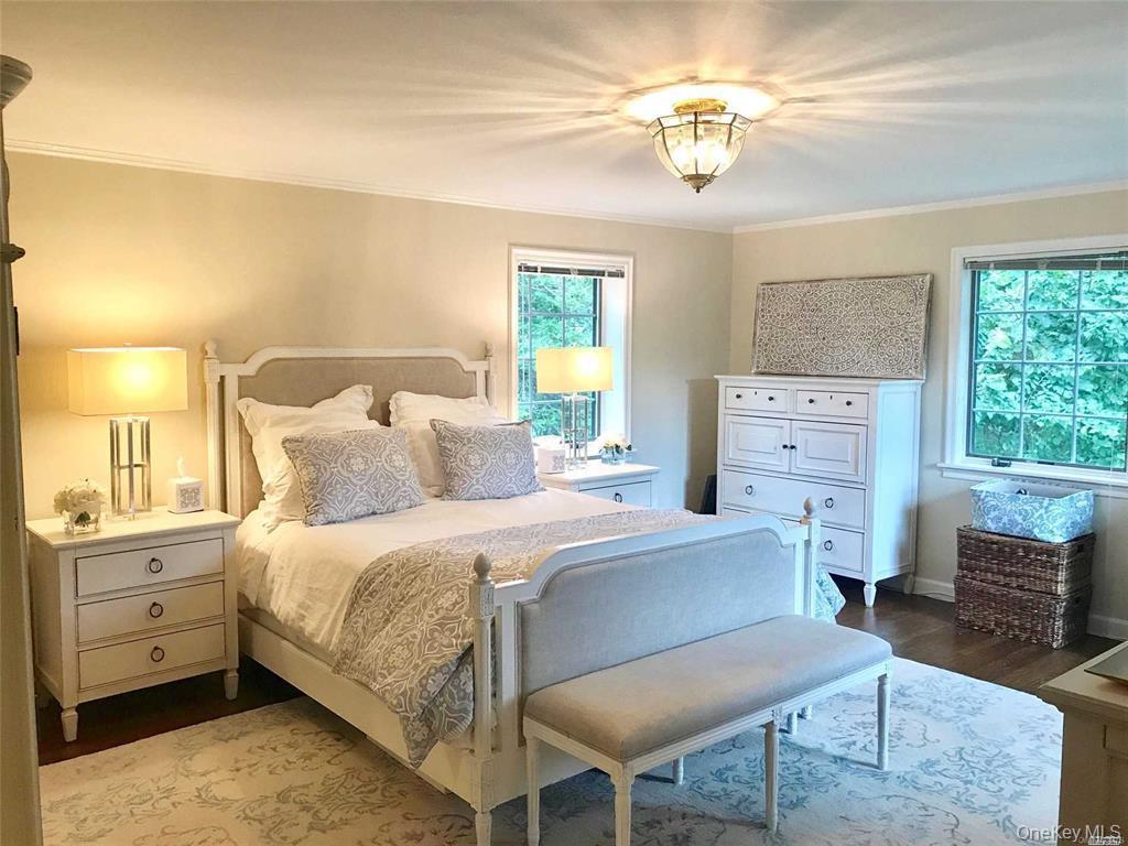 5 Rockcrest Road Manhasset, NY 11030 - Photo 11 of 16 Bedroom with wood finished floors, ornamental molding, and baseboards