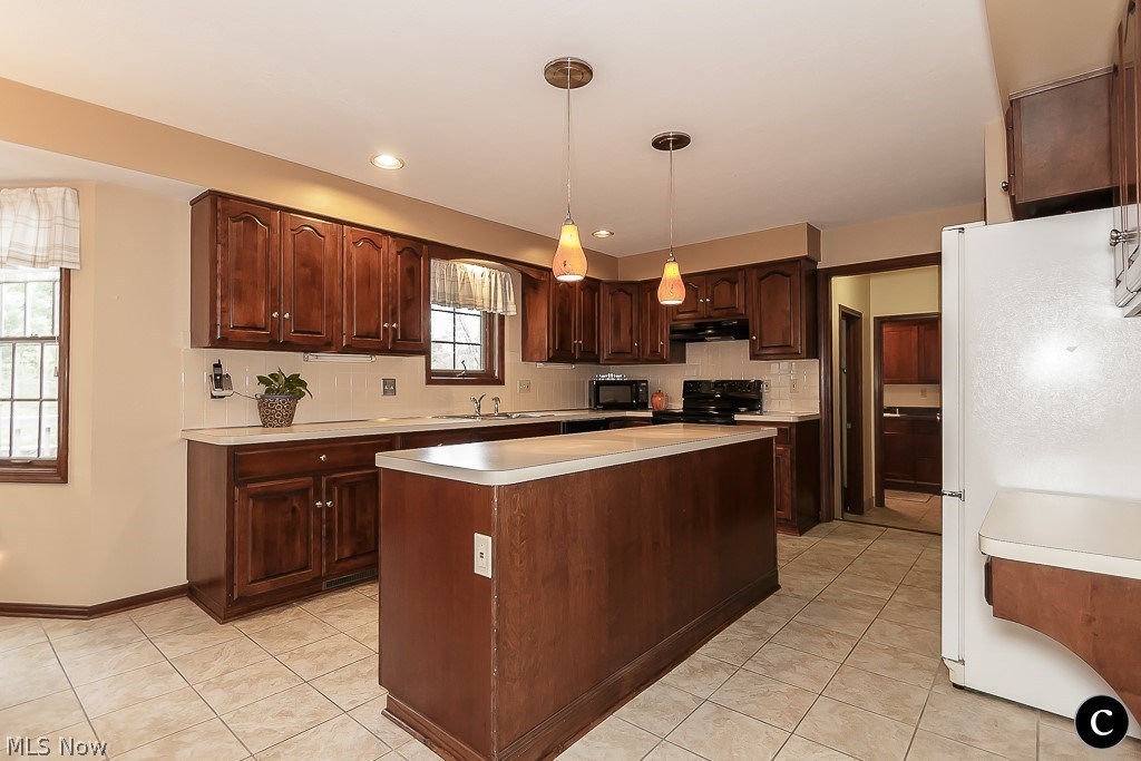 35785 Bainbridge Road Solon, OH 44139 - Photo 10 of 29 huge kitchen with plenty of counter space and storage! Solid wood cabinets and lots of room for entertaining