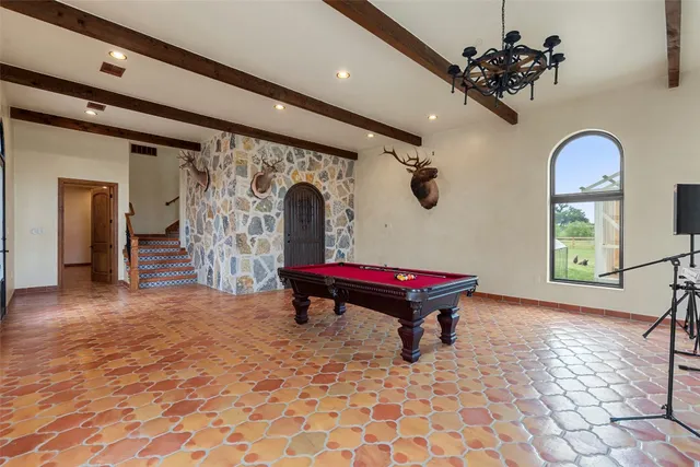 a room with lots of furniture and a rug