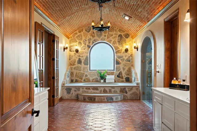 a bathroom with a bathtub and a shower