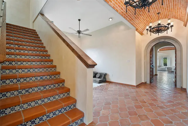 an aerial view of a house with outdoor space swimming pool