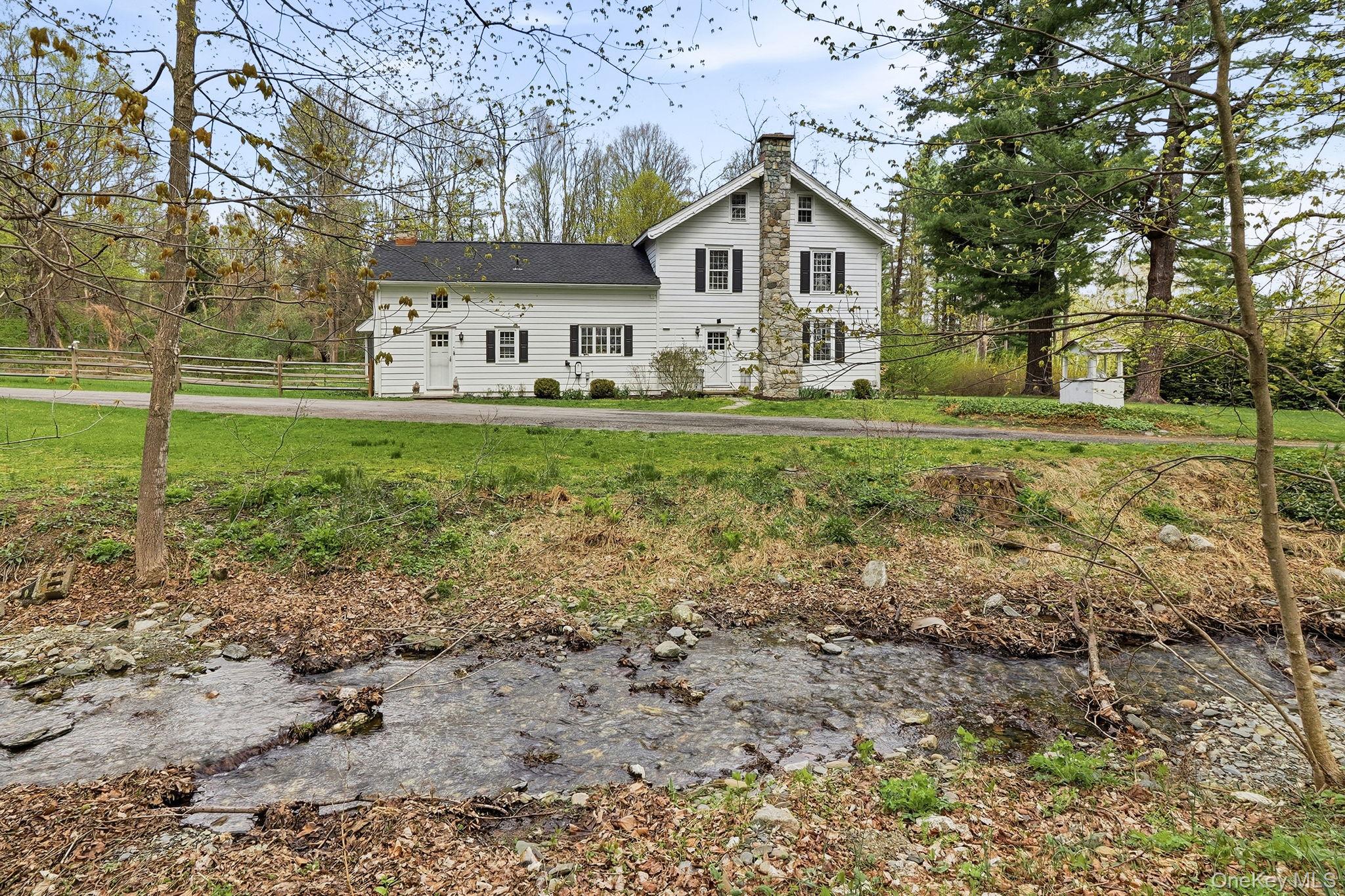 1141 Beekman Road Hopewell Junction, NY 12533 - Photo 33 of 36 a view of a house with yard and a tree