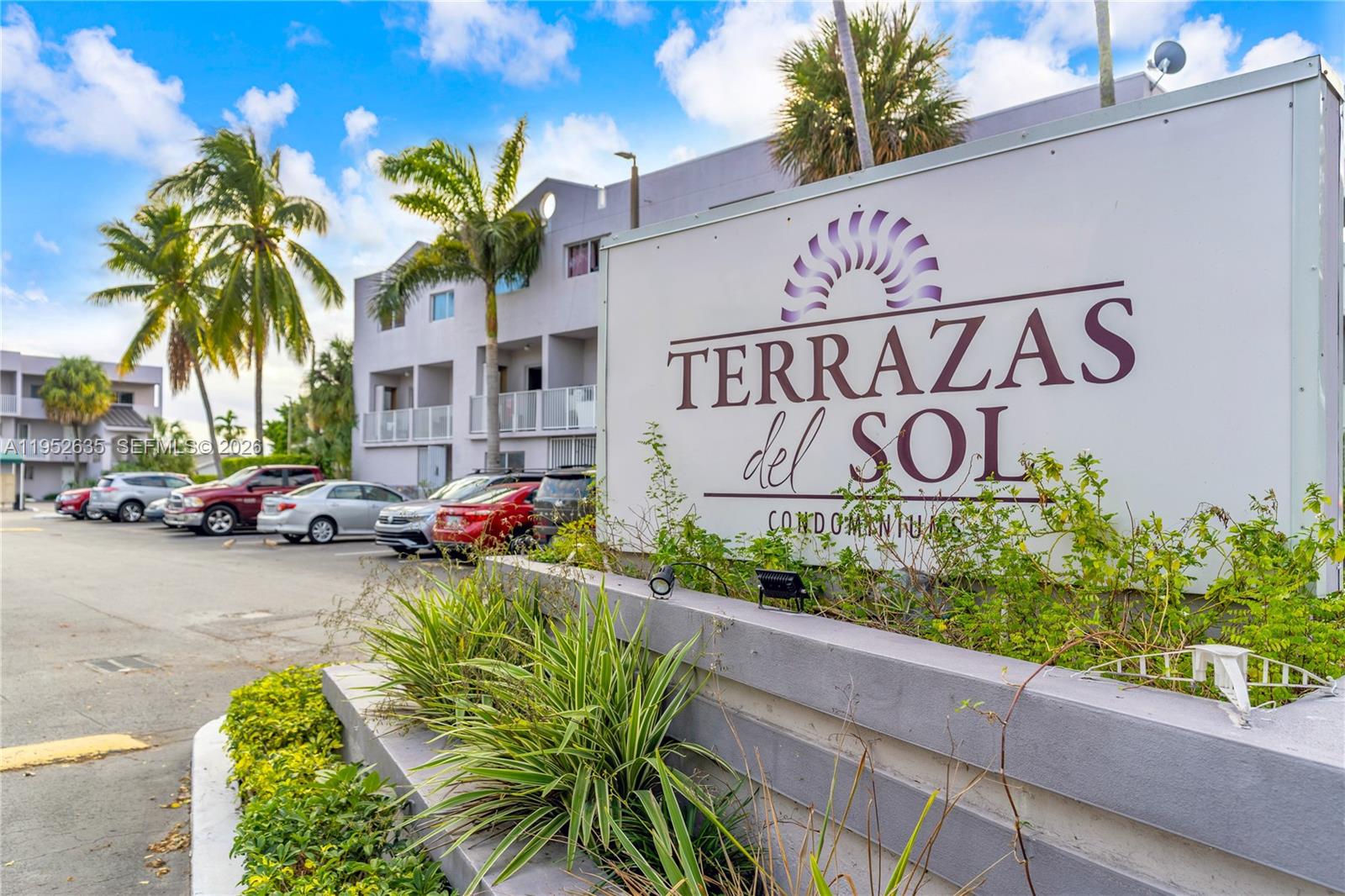 2690 West 76th Street, Unit 104 Hialeah, FL 33016 - Photo 1 of 25 a sign on the side of a building