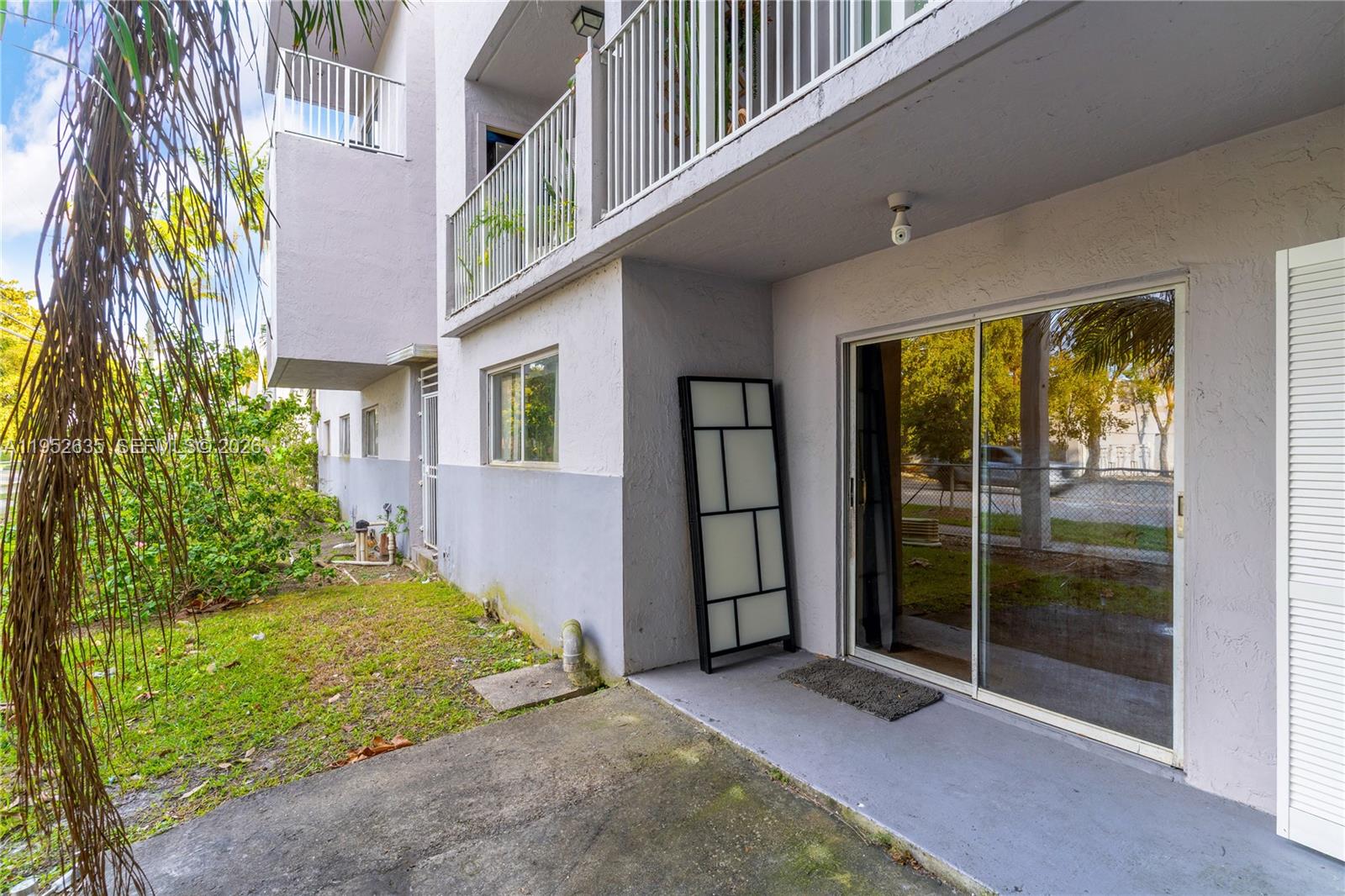 2690 West 76th Street, Unit 104 Hialeah, FL 33016 - Photo 20 of 25 a view of a garden from a windows