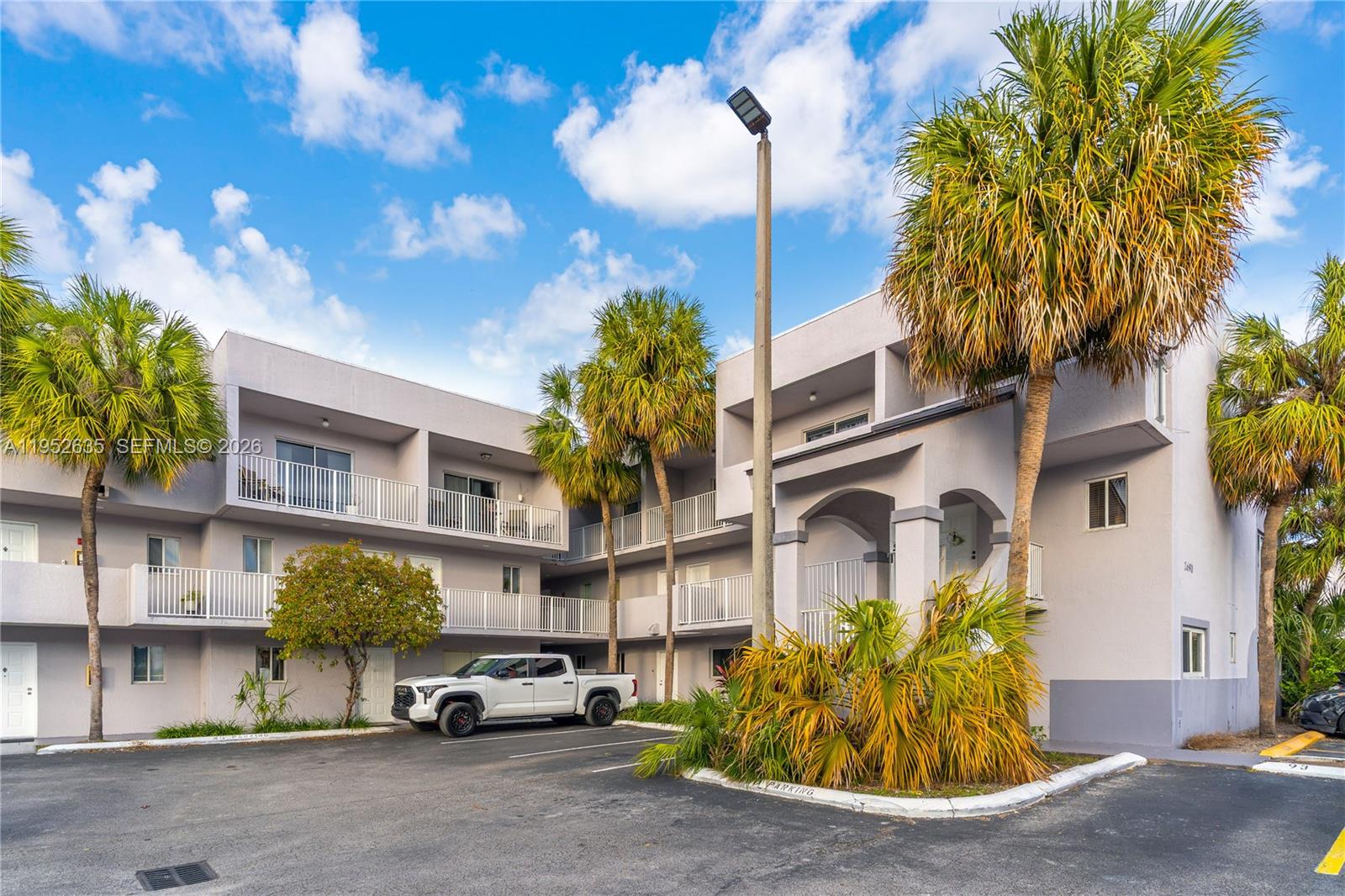 2690 West 76th Street, Unit 104 Hialeah, FL 33016 - Photo 2 of 25 a car parked in front of a building