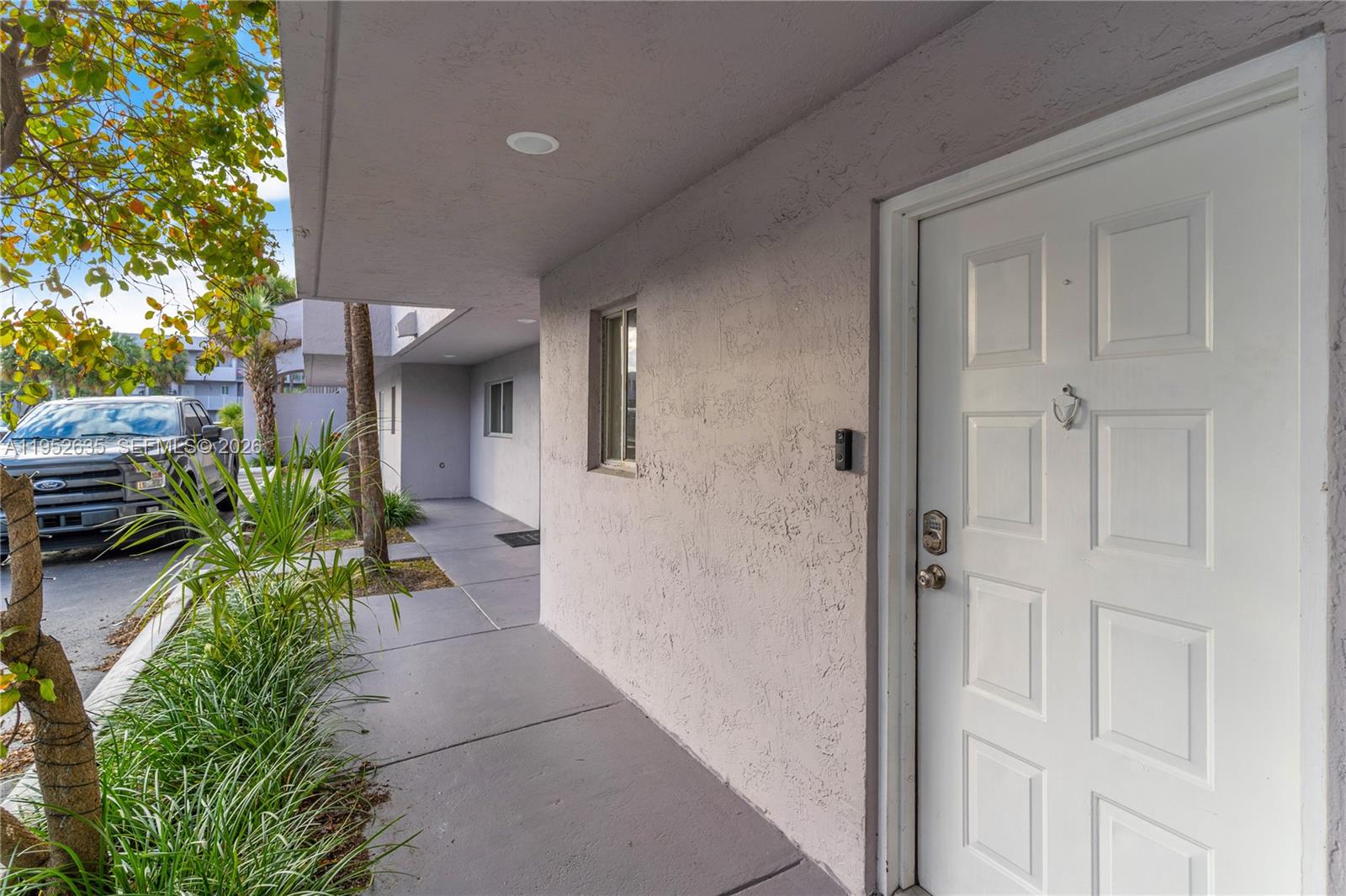 2690 West 76th Street, Unit 104 Hialeah, FL 33016 - Photo 3 of 25 view of a house with a backyard and garden