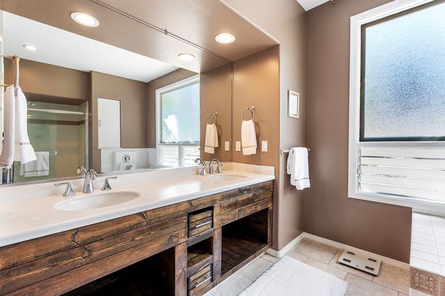 a spacious bathroom with a bathtub and a shower