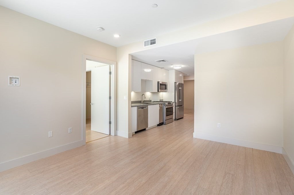 121 Portland Street, Unit 7O8 Boston, MA 02114 - Photo 15 of 40 a view of kitchen with wooden floor