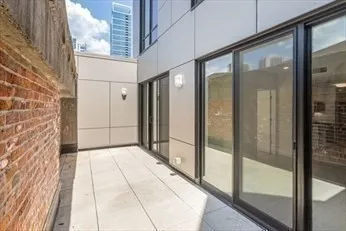 a view of a chairs and table in the outdoor space