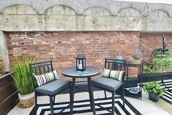 a view of outdoor seating area with green space