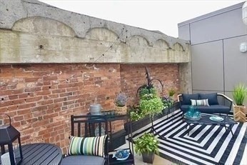 121 Portland Street, Unit 7O8 Boston, MA 02114 - Photo 24 of 40 a view of outdoor seating area with green space