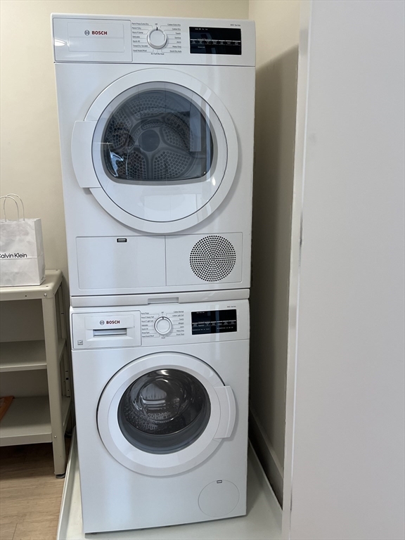 121 Portland Street, Unit 7O8 Boston, MA 02114 - Photo 28 of 40 a utility room with dryer and washer