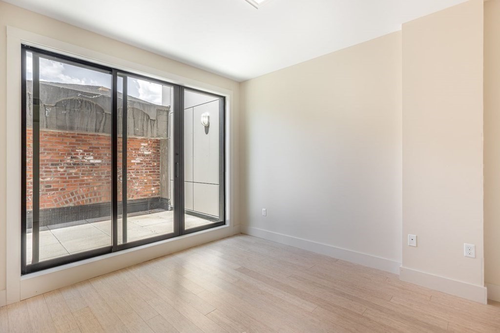 121 Portland Street, Unit 7O8 Boston, MA 02114 - Photo 3 of 40 a view of entryway with wooden floor