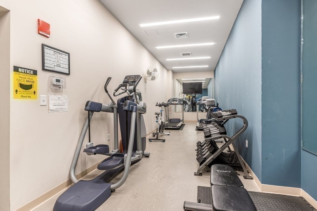 121 Portland Street, Unit 7O8 Boston, MA 02114 - Photo 32 of 40 a view of a room with gym equipment