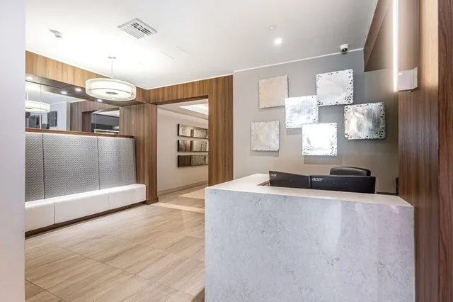 a view of a hallway with a chandelier