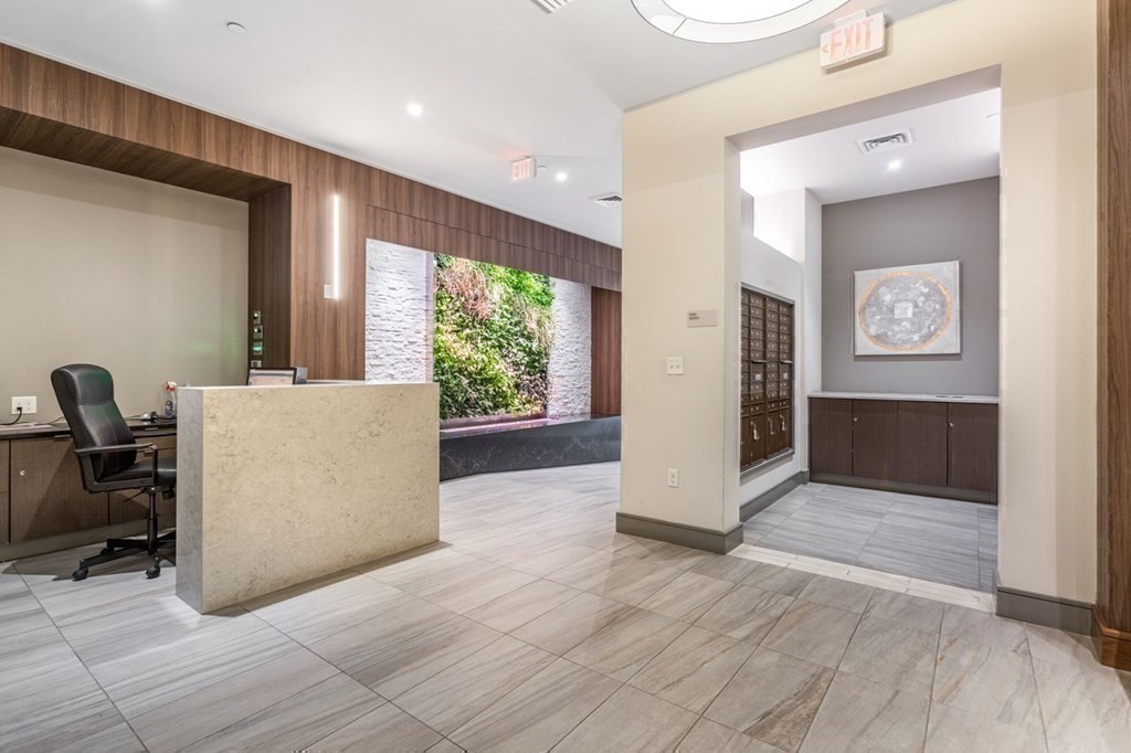 121 Portland Street, Unit 7O8 Boston, MA 02114 - Photo 35 of 40 a view of a hallway with workspace and a window