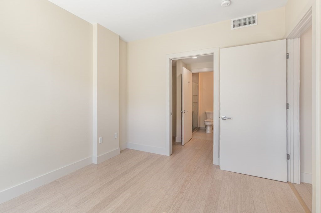 121 Portland Street, Unit 7O8 Boston, MA 02114 - Photo 5 of 40 a view of a room with wooden floor