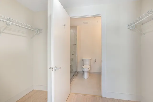 a bathroom with a toilet and a shower