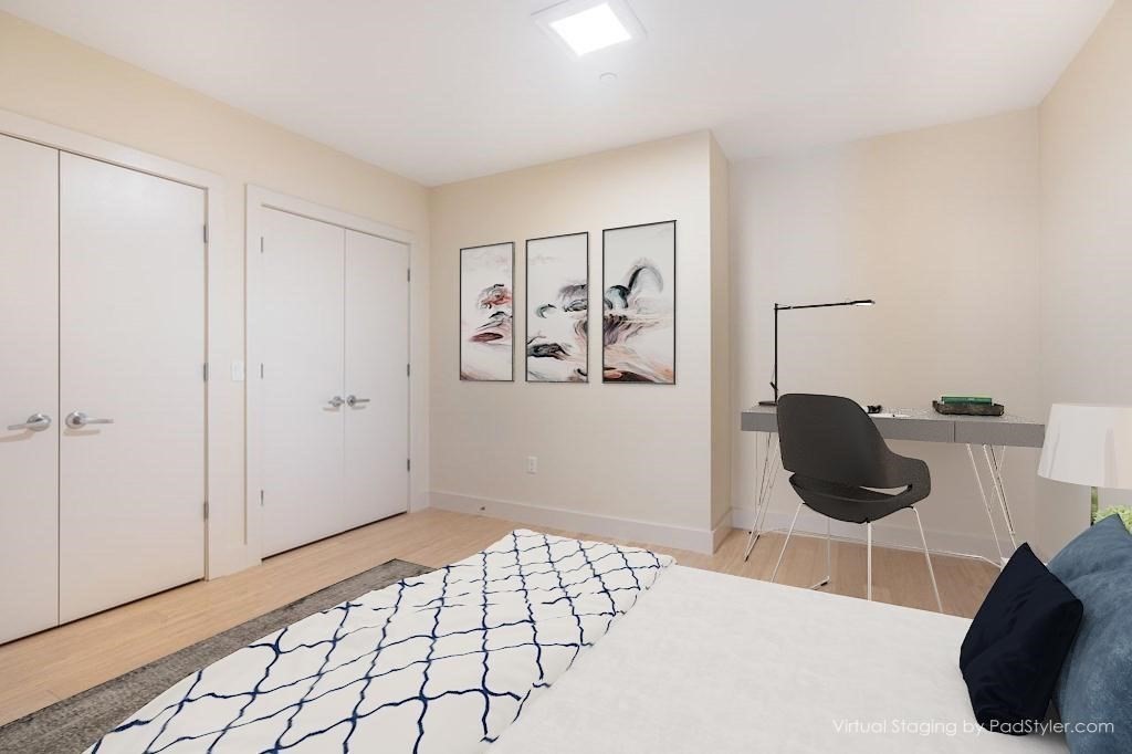 121 Portland Street, Unit 7O8 Boston, MA 02114 - Photo 9 of 40 a bedroom with a bed and a window