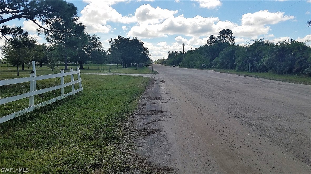 11661 Shawnee Road Fort Myers, FL 33913 - Photo 9 of 9 a view of a field with wooden fence